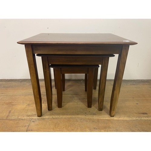 845 - A Chinese low table, 70 cm wide, a mahogany stand, 50 cm wide, a nest of tables, a chest of small pr... 