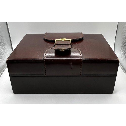 320 - A vintage leather Rolex box, 21 cm wide