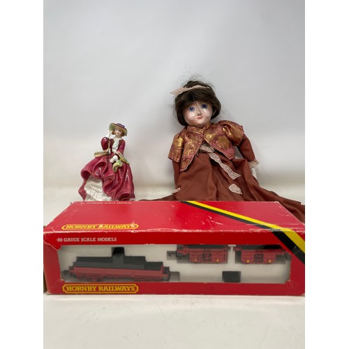 821 - An early 20th century doll, restored, a Royal Doulton figure, assorted silver plated flatwares, and ... 