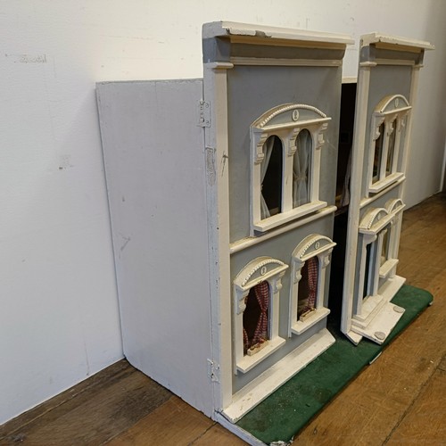 734 - A painted dolls house, 73 cm high x 81 cm wide