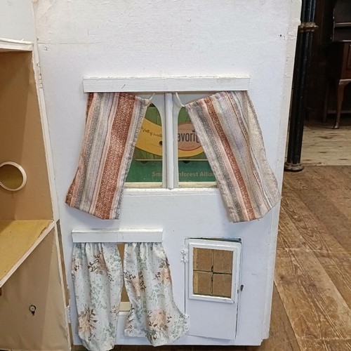 734 - A painted dolls house, 73 cm high x 81 cm wide