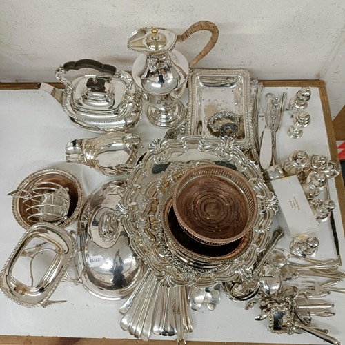 582 - A silver plated hot water jug, a pair of silver plated bottle coasters, a kettle on stand, and assor... 