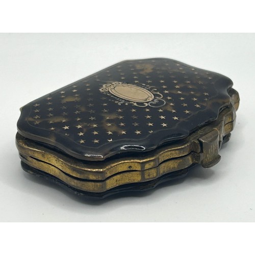 1438 - A late 19th/early 20th century tortoiseshell and gilt metal purse