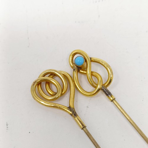 1437 - A pair of yellow coloured metal, turquoise and gilt metal hairpins (2)