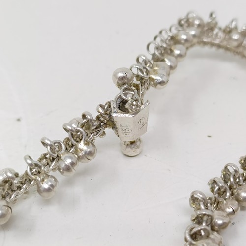 1430 - A pair of Indian silver coloured metal ankle bracelets