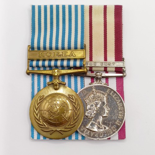 704 - A pair of medals, awarded to P/JX 919975 A B Smith AB RN, comprising a Naval General Service Medal, ... 