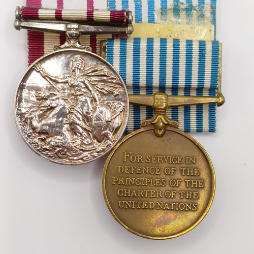 704 - A pair of medals, awarded to P/JX 919975 A B Smith AB RN, comprising a Naval General Service Medal, ... 