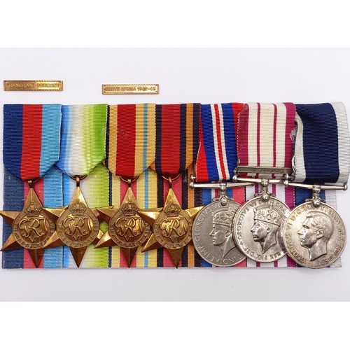 705 - A group of seven medals, awarded to KX 82591 A C Brundenell PO SM RN, comprising a 1939-1945 Star, a... 