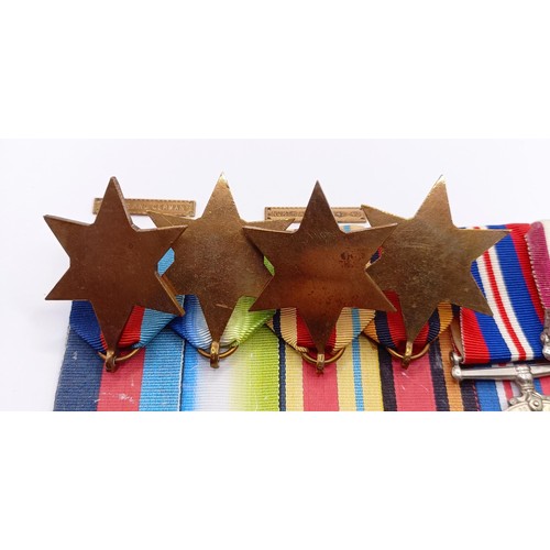 705 - A group of seven medals, awarded to KX 82591 A C Brundenell PO SM RN, comprising a 1939-1945 Star, a... 