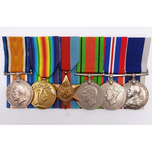 715 - A group of six medals, awarded to K-29098 William Henry Toms STO 1 HMS Iron Duke, comprising a Briti... 