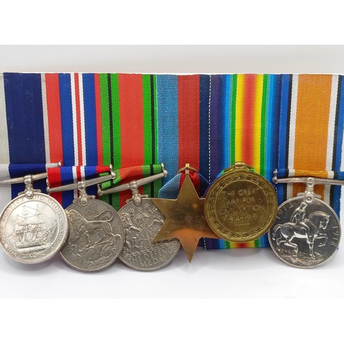 715 - A group of six medals, awarded to K-29098 William Henry Toms STO 1 HMS Iron Duke, comprising a Briti... 