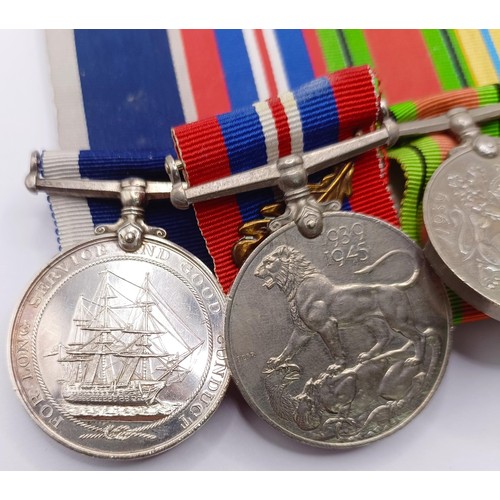 717 - A group of seven medals, awarded to J 73412 A L Draper B Tel RN, comprising a British War Medal, a V... 