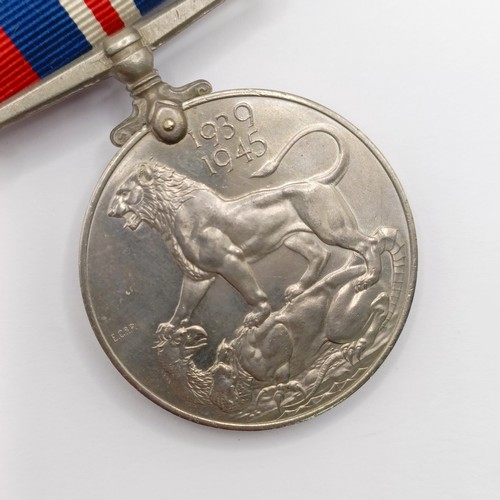 719 - A group of eight medals, awarded to J 62885 F J Spiers O Tel RN, comprising a British War Medal, a V... 