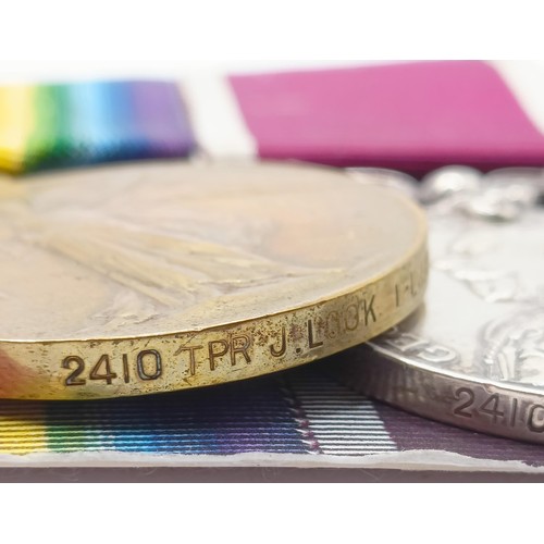 736 - A group of four medals, awarded to 2410 Tpr J Look 1/Life Guards, comprising a 1914 Star Trio, with ... 