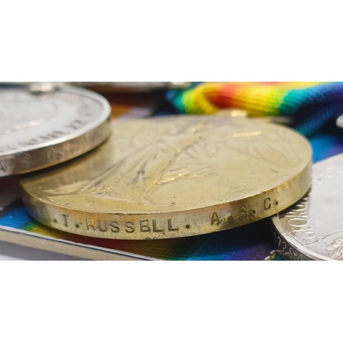 751 - A group of four medals, awarded to T4-091754 Dvr T Russell ASC, comprising a 1914-15 Star Trio, and ... 