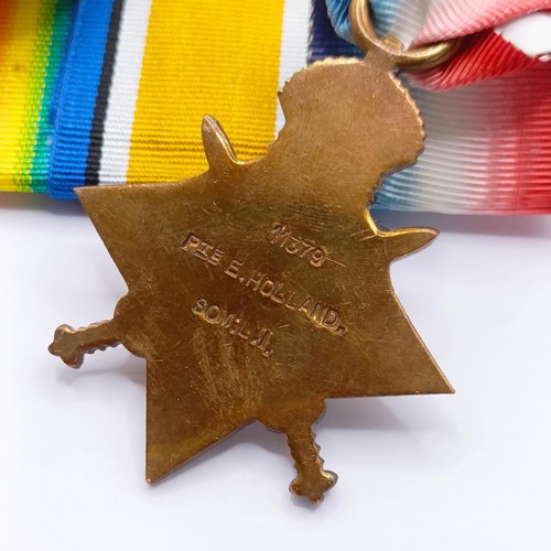 761 - A 1914-15 Star Trio, awarded to 11379 Pte E Holland Som LI  Provenance:  From a lifetime of medal co... 