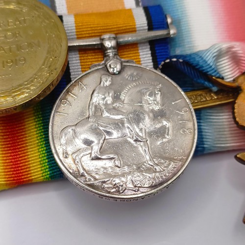 765 - A group of four medals, awarded 6913 Pte A J Andrews 1/Hamps R, comprising a 1914-15 Star Trio, with... 