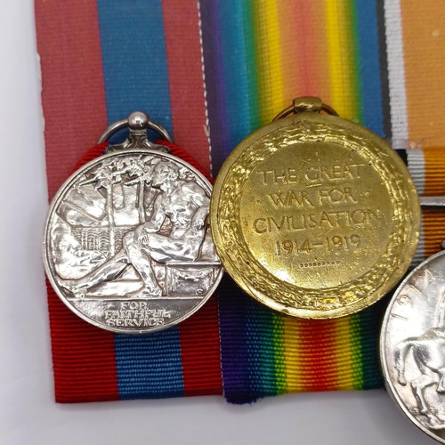 765 - A group of four medals, awarded 6913 Pte A J Andrews 1/Hamps R, comprising a 1914-15 Star Trio, with... 