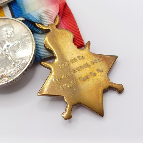 795 - A group of four medals, awarded to 282557 A J Reynolds CH STO RN, comprising a 1914-15 Star Trio, an... 