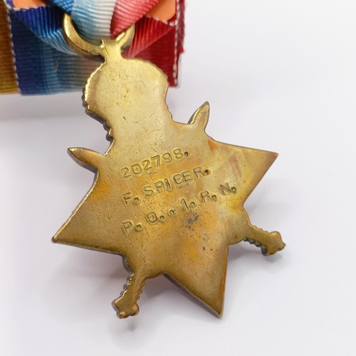 796 - A group of four medals, awarded to 202798 F Spicer PO1 RN, comprising a 1914-15 Star Trio and a LS &... 