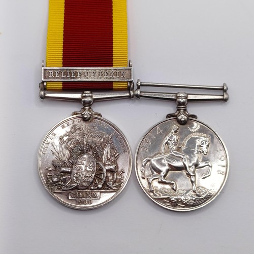 805 - A pair of medals, comprising a China War Medal 1900, with Relief Of Pekin (Interpreter B M Nevill Pe... 