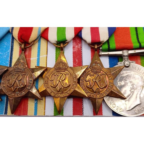 808 - A group of seven medals, awarded to Const David W Austin, comprising a 1939-1945 Star, an Africa Sta... 