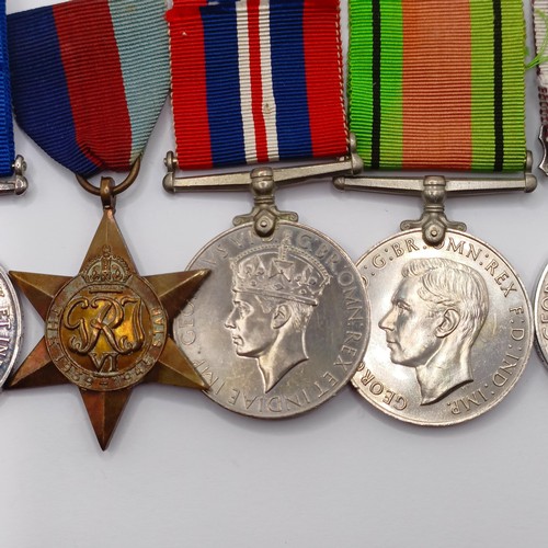 810 - A group of seven medals, awarded to 1862498 Sjt F C Philpot RAOC, comprising a British War Medal, a ... 