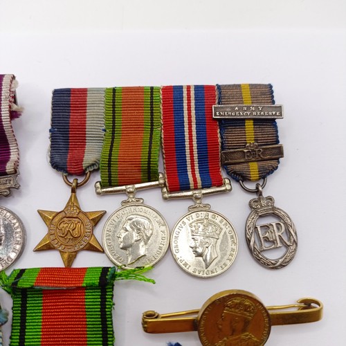 811 - Assorted miniature medals, in groups and singles  Provenance:  From a lifetime of medal collecting