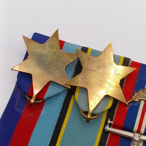 813 - A group of three medals, comprising a 1939-1945 Star and Air Crew Europe Star, and a War Medal (MID)... 