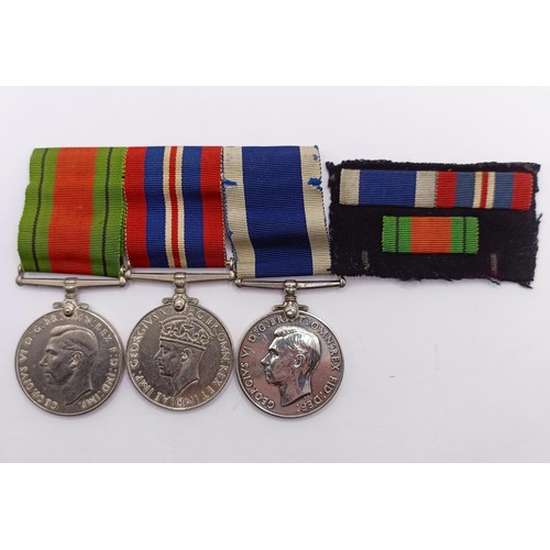 819 - A group of three medals, awarded to MX57177 J S Smyth CPO WTR HMS Alaunia, comprising a Defence Meda... 