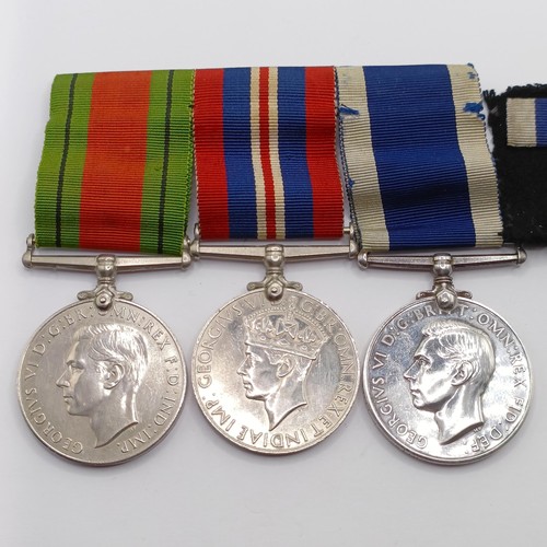 819 - A group of three medals, awarded to MX57177 J S Smyth CPO WTR HMS Alaunia, comprising a Defence Meda... 