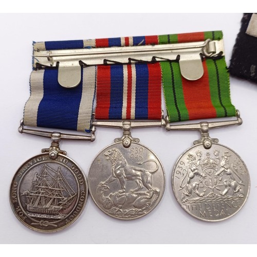 819 - A group of three medals, awarded to MX57177 J S Smyth CPO WTR HMS Alaunia, comprising a Defence Meda... 