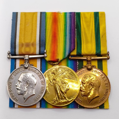 821 - A group of three medals, awarded to 240519 Pte W Knight E Surrey R, comprising a British War Medal a... 