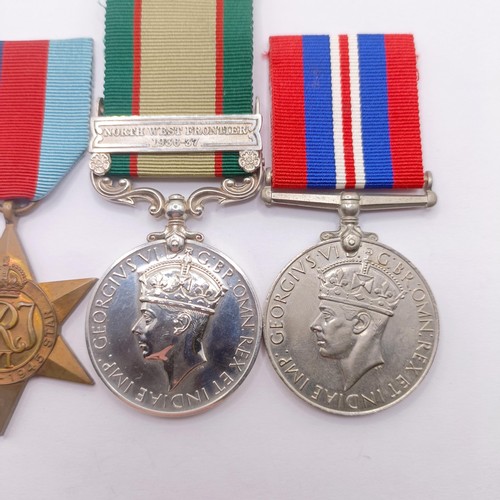 823 - A group of four medals, attributed to 1018052 Sjt S Biggerstaff RA, comprising an India General Serv... 