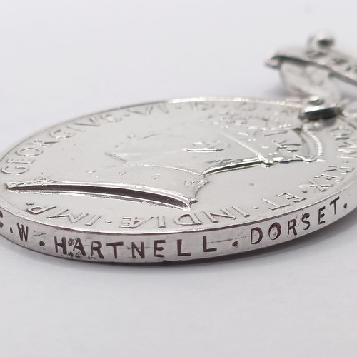 828 - A group of five medals, awarded to 5726447 Pte C W Hartnell Dorset, comprising a 1939-1945 Star, a F... 