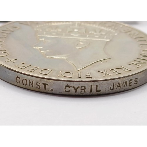 855 - A group of three medals, awarded to Const Cyril James, comprising a Defence Medal, an Exemplary Poli... 