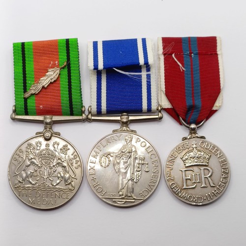 855 - A group of three medals, awarded to Const Cyril James, comprising a Defence Medal, an Exemplary Poli... 