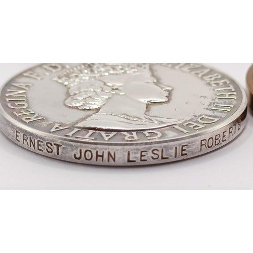 861 - An Imperial Service Medal, awarded to Ernest John Leslie Roberts, a Special Constabulary Medal, awar... 