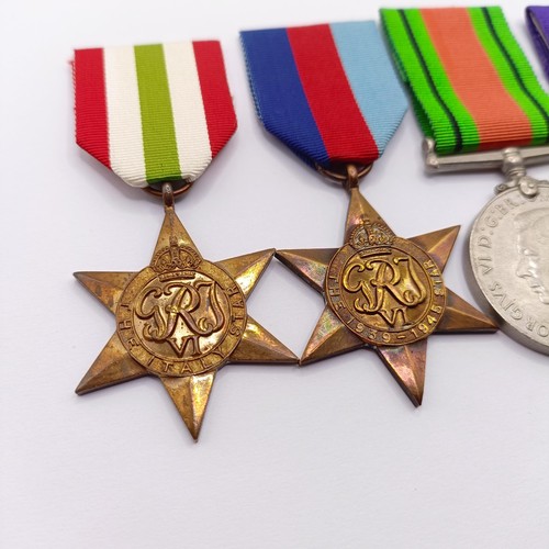 880 - A group of four medals, awarded to 1873861 Spr D D Launder RE, comprising a 1939-1945 Star, an Italy... 