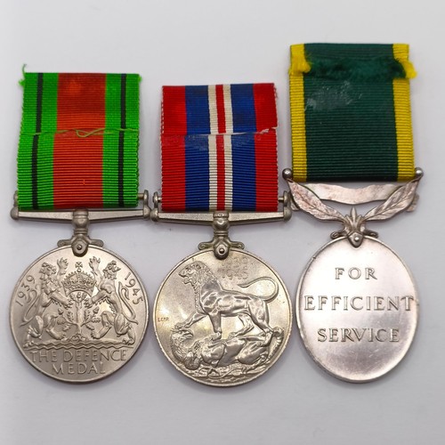 888 - A group of three medals, awarded to S.924924 Pte A F Dunning RASC, comprising a Defence Medal, a War... 