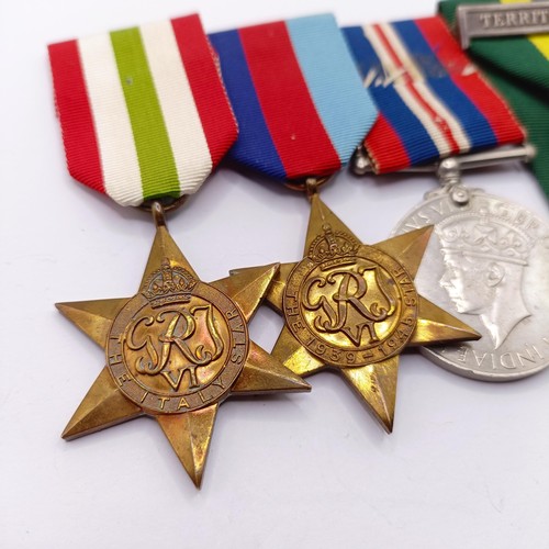 900 - A group of four medals, comprising a 1939-1945 Star, an Italy Star, a War Medal and a Territorial Ef... 