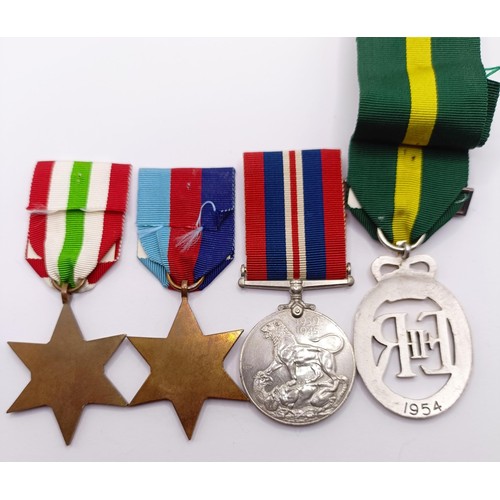 900 - A group of four medals, comprising a 1939-1945 Star, an Italy Star, a War Medal and a Territorial Ef... 