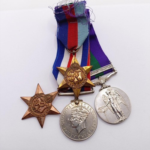 909 - A group of four medals, awarded to 14321729 Gnr R Moss RA, comprising a 1939-1945 Star, a France and... 