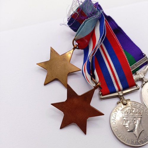 909 - A group of four medals, awarded to 14321729 Gnr R Moss RA, comprising a 1939-1945 Star, a France and... 