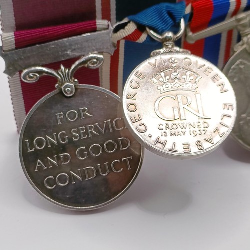 916 - A group of seven medals, awarded to 39212 Gnr H A J Field RA, comprising a British War Medal and Vic... 