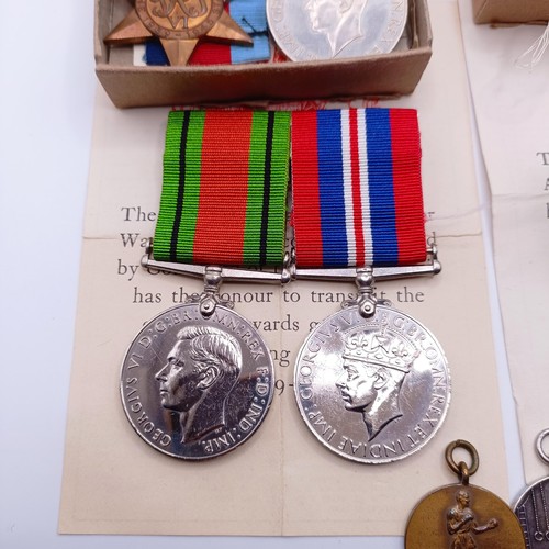 920 - Two groups of WWII medals in boxes of issue, addressed to Mr E C Hewitt and Mr J F Hewitt, a small s... 