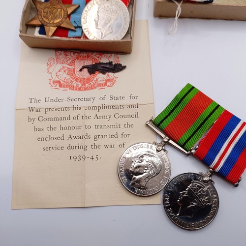 920 - Two groups of WWII medals in boxes of issue, addressed to Mr E C Hewitt and Mr J F Hewitt, a small s... 