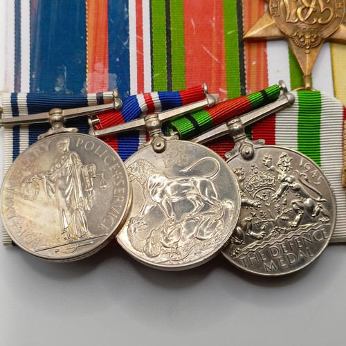 921 - A group of six medals, awarded to Const Kenneth V Mitchell, comprising a 1939-1945 Star, an Africa S... 