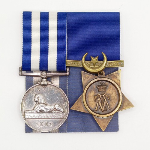 701 - A pair of medals, awarded to William Burnhill HMS Minotar, comprising an Egypt Medal 1882, and a Khe... 