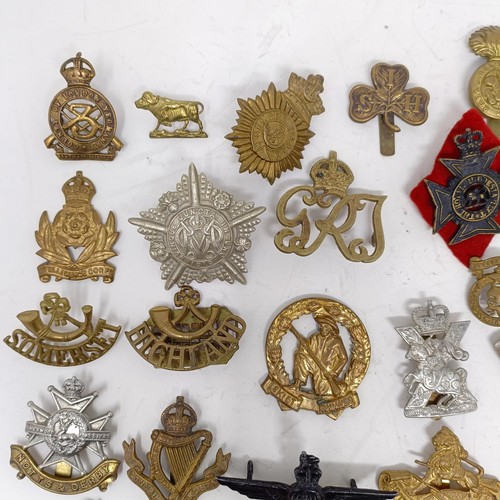 981 - Assorted military cap and other badges